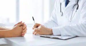 close up of doctor talking to patient.